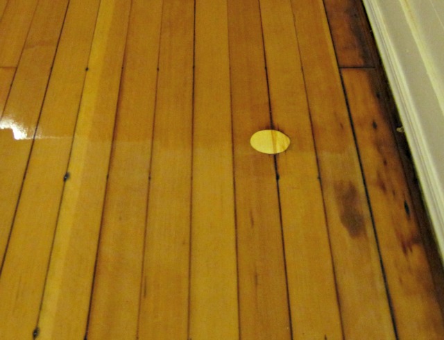 Repairing a hole in a hardwood floor- the finished product! The hole was fixed by making a plug out of scrap lumber. See the full tutorial! Plug in hardwood floor- how to fix a hole in a hardwood floor